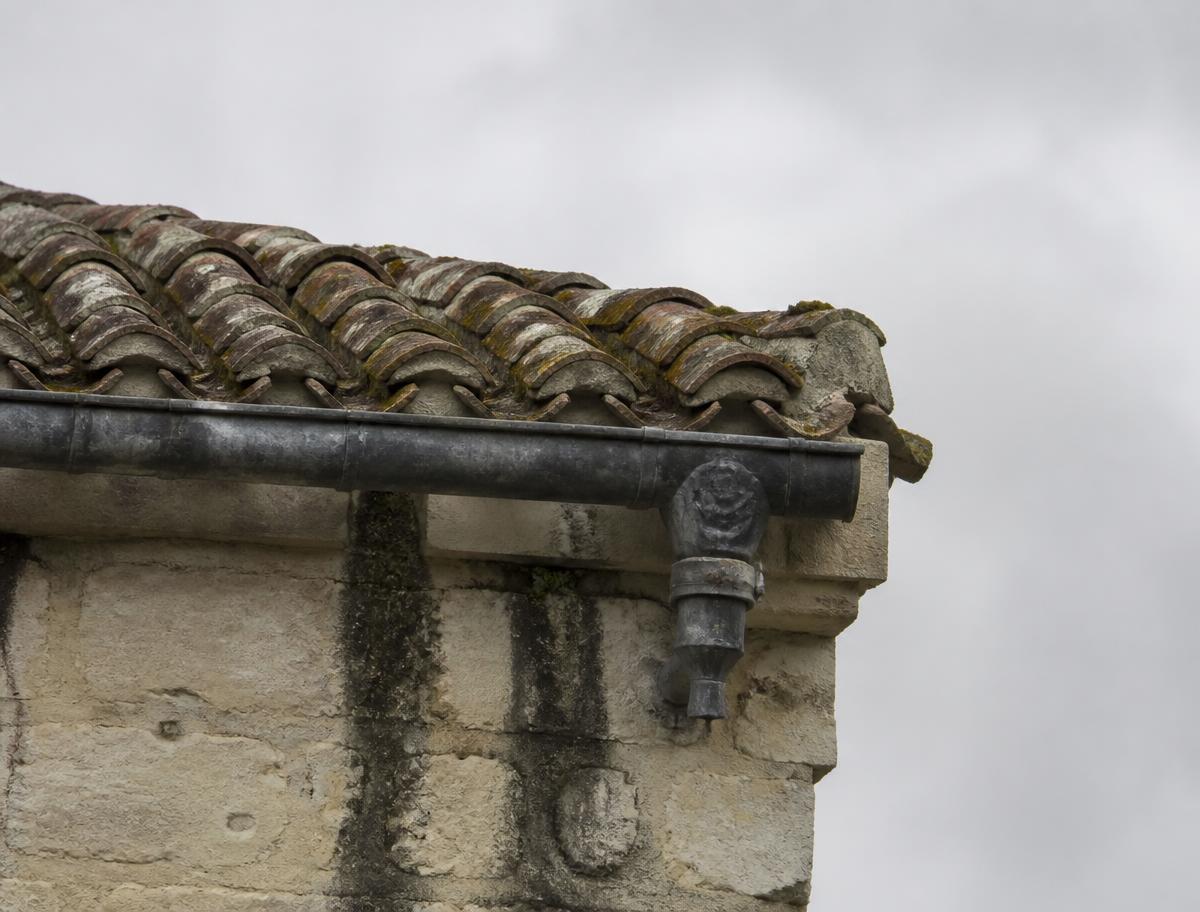 Eaves and rainwater goods with damp staining below