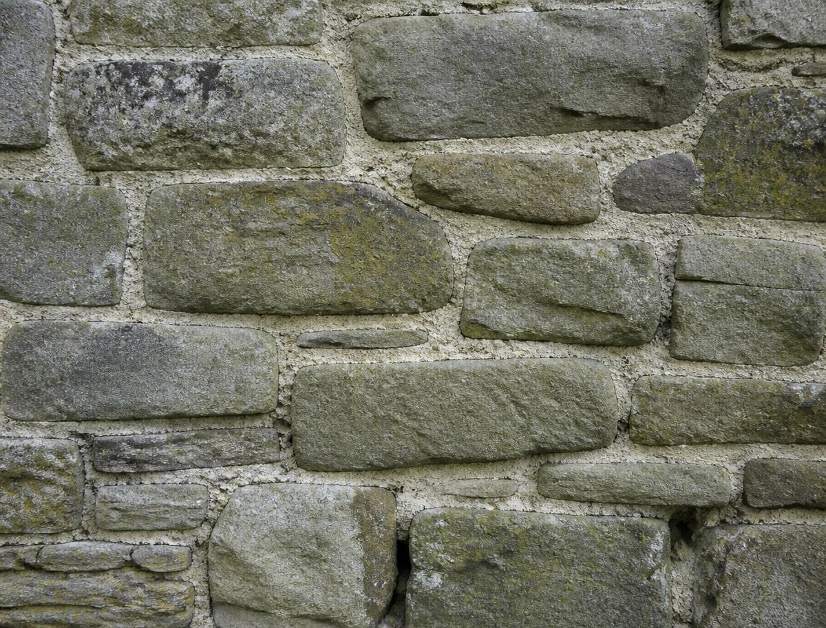 Stone wall repointed with lime mortar